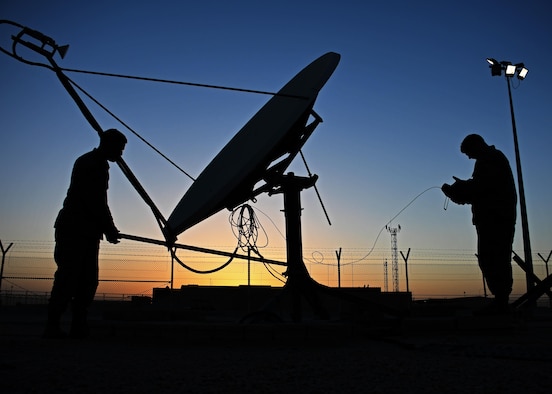 U.S. Air Force Staff Sgt. Chris Hayes, a Bounty Hunter crew chief, and U.S. Air Force Staff Sgt. Lucas Woods, a defensive space control maintainer, both with the 379th Expeditionary Operations Support Squadron, manually redirect an antenna at Al Udeid Air Base, Qatar, Jan. 30, 2017. These antennas are an Operation Silent Sentry asset and help find and locate electromagnetic interference in the U.S. Central Command area of responsibility. (U.S. Air Force photo by Senior Airman Miles Wilson)