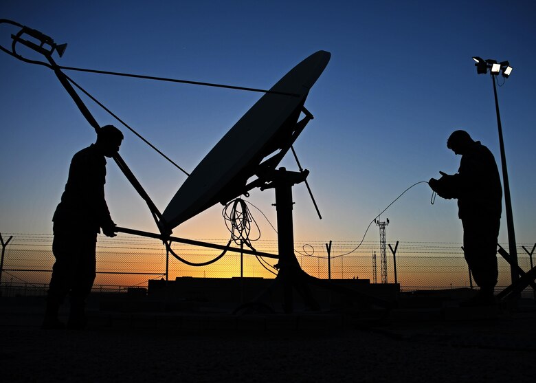 U.S. Air Force Staff Sgt. Chris Hayes, a Bounty Hunter crew chief, and U.S. Air Force Staff Sgt. Lucas Woods, a defensive space control maintainer, both with the 379th Expeditionary Operations Support Squadron, manually redirect an antenna at Al Udeid Air Base, Qatar, Jan. 30, 2017. These antennas are an Operation Silent Sentry asset and help find and locate electromagnetic interference in the U.S. Central Command area of responsibility. (U.S. Air Force photo by Senior Airman Miles Wilson)