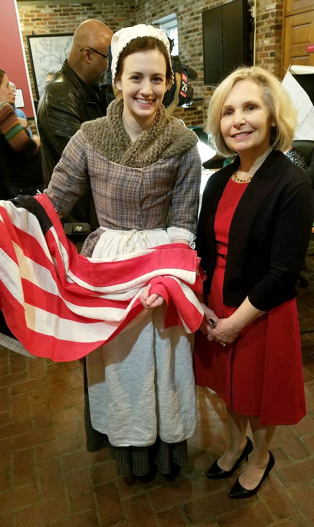 DLA Troop Support flag room embroider, right, met a Betsy Ross interpreter during a museum exhibit opening at the Betsy Ross House Feb. 17in Philadelphia. Farrell is one of 16 DLA embroiders featured in “Historic Threads: 250 Years of Flag Making in Philadelphia,” which highlights the city’s centuries-long tradition of flag making. 