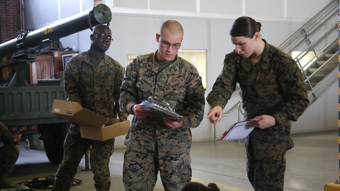 1st Lt. Morgan White, right, directs her Marines during a squadron-wide gear inspection aboard Marine Corps Air Station Cherry Point, N.C., Feb. 6, 2017. White states that the training she has received in the Marine Corps helped develop her leadership and decision-making skills. “The Marine Corps teaches you to make hard decisions,” said White. “When life throws us questions that we don’t know the answer to, we’ve learned to quickly think on our feet.” White is the communications officer for Marine Wing Support Squadron 274, Marine Aircraft Group 14, 2nd Marine Aircraft Wing.