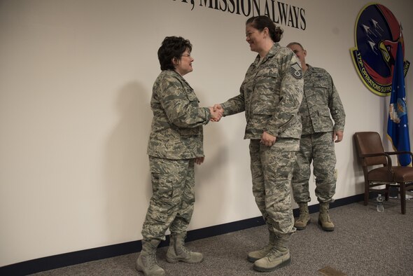 Maj. Gen. Gretchen S. Dunkelberger, Air National Guard Assistant to the Surgeon General, United States Air Force, presents challenge coins to selected Ohio Air National Guard Medical Service members during a visit to the 179th Airlift Wing in Mansfield, Ohio, Feb. 4, 2017. During the visit, Maj. Gen. Dunkelberger met with leadership including Maj. Gen. Stephen E. Markovich, Commander of the Ohio Air National Guard, and spoke with airmen from the 179th Medical Group about the work being done at her level on behalf of the 6000+ men and women of the Air National Guard Medical Service. (U.S. Air National Guard photo by Tech. Sgt. Joe Harwood\Released)
