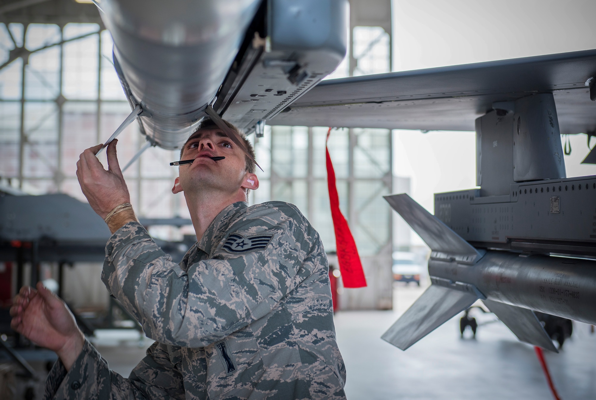 Staff Sgt. Benjamin O’Connor, 96th Aircraft Maintenance Squadron, Blue Crew, performs last minute checks after loading an AIM-120 on the wing of an F-16 Fighting Falcon during a weapons load competition Feb. 17 at Eglin Air Force Base, Fla. The 30-minute competition tests the knowledge and proficiency of the crews. The annual competition also identifies the load crew of the year and earns them bragging rights as the best of 22. The winning crew is scheduled to be announced at the Maintenance Professionals of the Year Banquet in March. (U.S. Air Force photo/Ilka Cole)