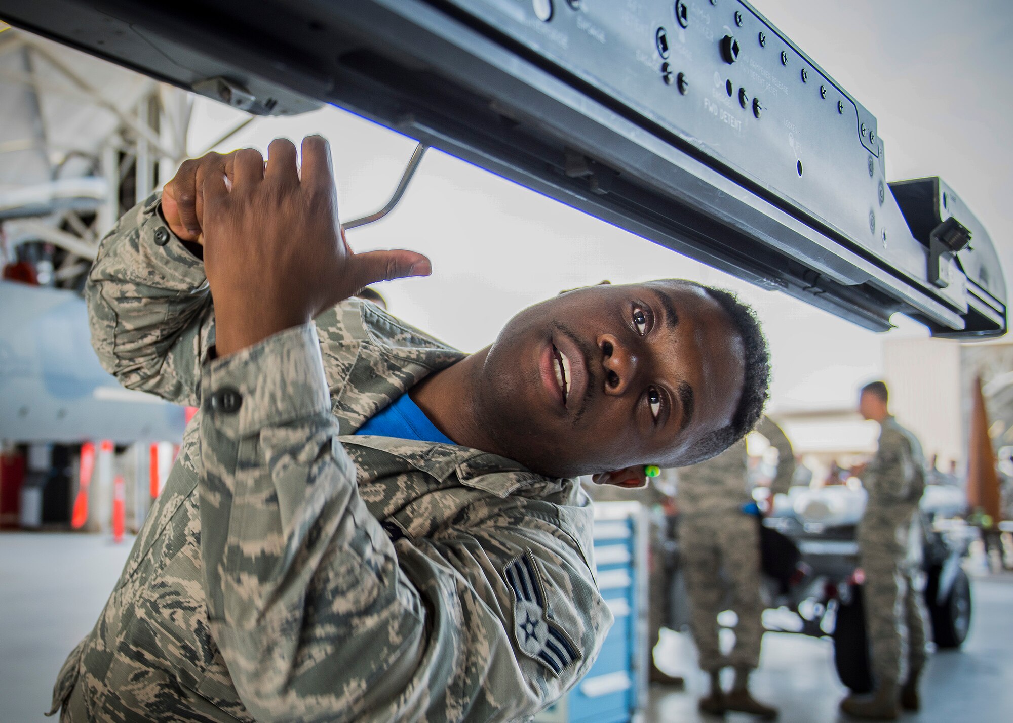 Senior Airman David Johnson, 96th Aircraft Maintenance Squadron Blue Crew, prepares the F-16 Fighting Falcon missile rail for an AIM-9 missile during a weapons load competition Feb. 17 at Eglin Air Force Base, Fla. The 30-minute competition tests the knowledge and proficiency of the crews. The annual competition also identifies the load crew of the year and earns them bragging rights as the best of 22. The winning crew is scheduled to be announced at the Maintenance Professionals of the Year Banquet in March. (U.S. Air Force photo/Ilka Cole)