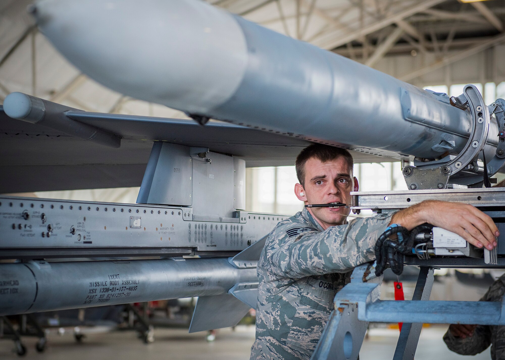 Staff Sgt. Benjamin O’Connor, 96th Aircraft Maintenance Squadron Blue Crew, secures an AIM-120 missile for loading on an F-16 Fighting Falcon during a weapons load competition Feb. 17 at Eglin Air Force Base, Fla. The 30-minute competition tests the knowledge and proficiency of the crews. The annual competition also identifies the load crew of the year and earns them bragging rights as the best of 22. The winning crew is scheduled to be announced at the Maintenance Professionals of the Year banquet in March. (U.S. Air Force photo/Ilka Cole)