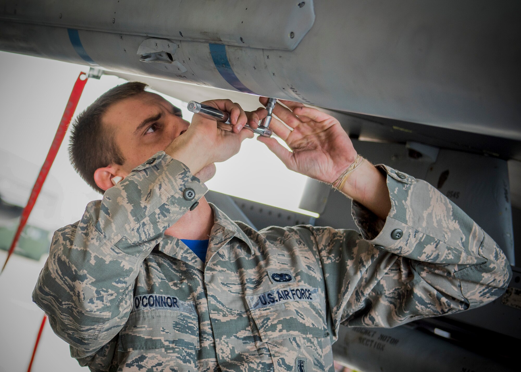 Staff Sgt. Benjamin O’Connor, 96th Aircraft Maintenance Squadron Blue Crew, secures the umbilical of an AIM-120 missile on an F-16 Fighting Falcon during a weapons load competition Feb. 17 at Eglin Air Force Base, Fla. The 30-minute competition tests the knowledge and proficiency of the crews. The annual competition also identifies the load crew of the year and earns them bragging rights as the best of 22. The winning crew is scheduled to be announced at the Maintenance Professionals of the Year Banquet in March. (U.S. Air Force photo/Ilka Cole)