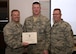 Ohio Air National Guard Master Sgt. Brian Stiteler, 178th Civil Engineering Squadron, receives a superior performance award from Colonel John Knable, 178th Wing Commander, and Command Chief Master Sergeant Scott Mckenzie, 178th Wing Command Chief, 6 February 4, 2017, at Springfield Air National Guard Base, Ohio.  Stiteler earned the award for his performance during the recent Air Combat Command mid-point inspection. (Ohio Air National Guard Photo by Master Sgt. Seth Skidmore)