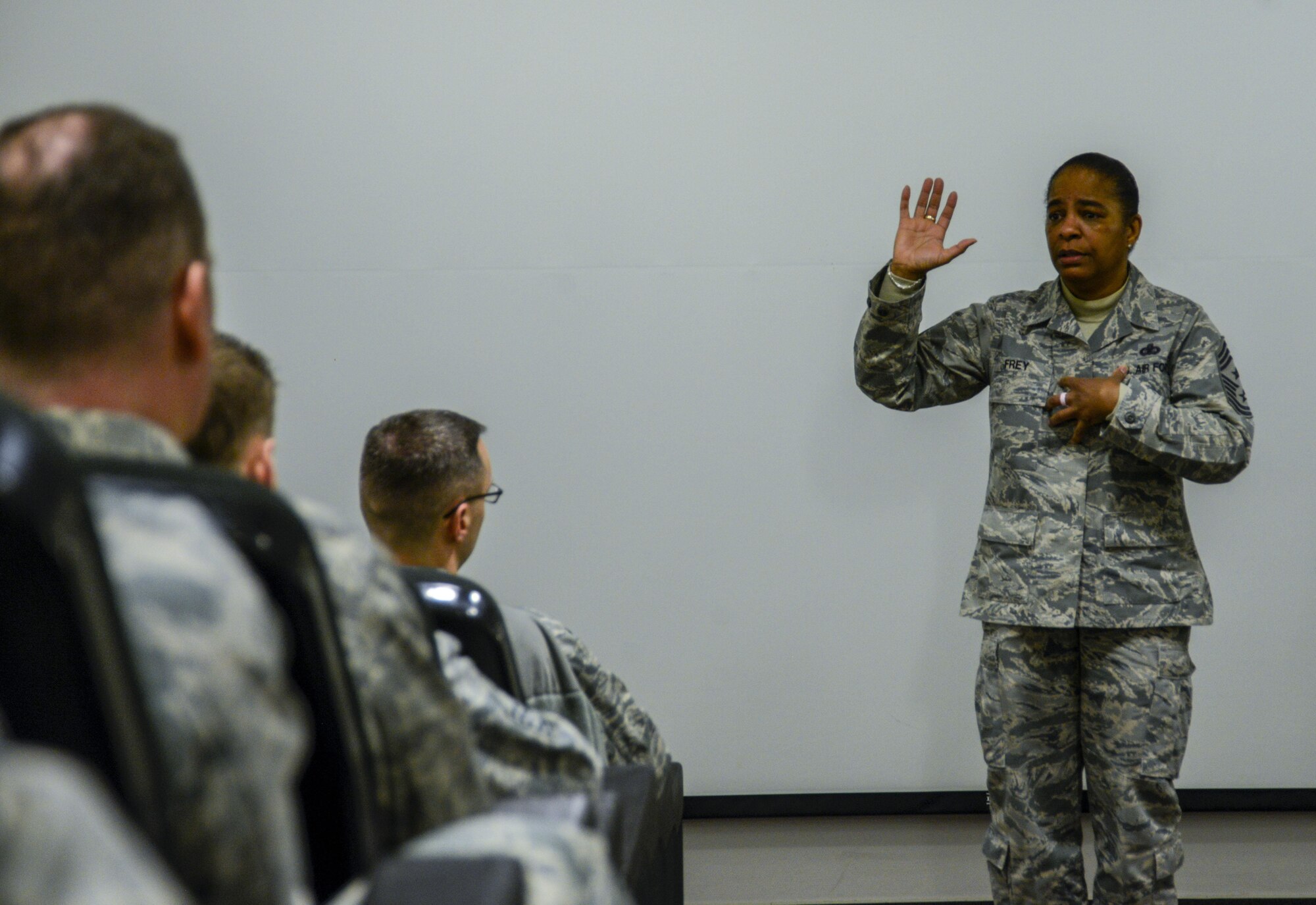 Chief Master Sgt. Shelina Frey, command chief of Air Mobility Command, speaks to attendees of the 521st Air Mobility Wing commander’s conference on Ramstein Air Base, Germany, Feb. 14, 2017. Frey encouraged the commanders, superintendents and first sergeants present to remember the “I,” the person who voluntarily took the oath to defend and protect the United States. (U.S. Air Force photo/Staff Sgt. Timothy Moore)