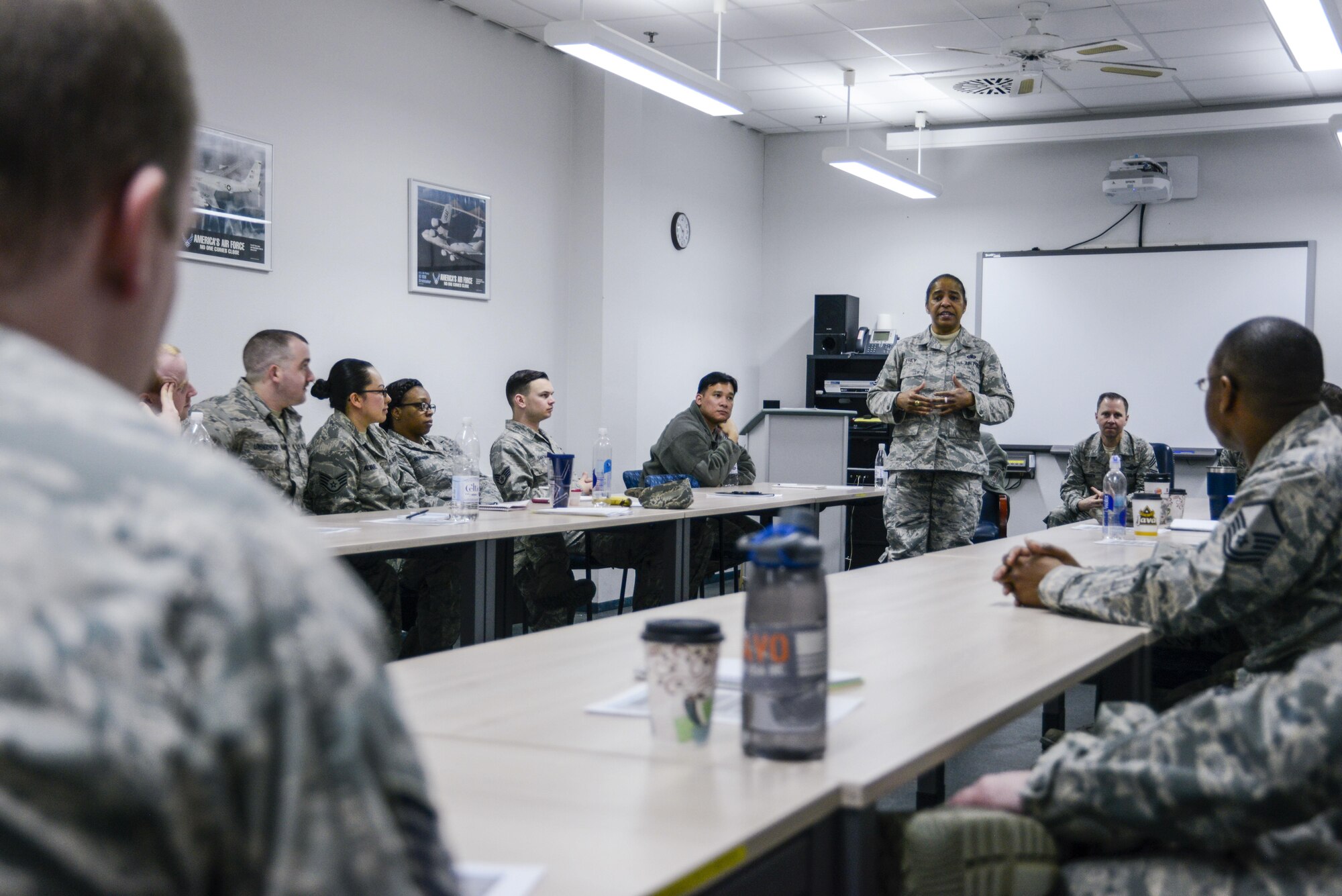 Chief Master Sgt. Shelina Frey, command chief of Air Mobility Command, speaks to attendees of the a professional development seminar hosted by the 521st Air Mobility Wing’s 721st Aerial Port Squadron on Ramstein Air Base, Germany, Feb. 14, 2017. Frey and Chief Master Sgt. Mark Redden, 521 AMOW command chief, and Chief Master Sgt. Timothy Debeaux, 521st Air Mobility Operations Group superintendent, spoke to the attendees about not only taking care of their Airmen but also themselves. (U.S. Air Force photo/Staff Sgt. Timothy Moore)