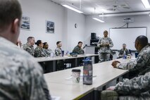 Chief Master Sgt. Shelina Frey, command chief of Air Mobility Command, speaks to attendees of the a professional development seminar hosted by the 521st Air Mobility Wing’s 721st Aerial Port Squadron on Ramstein Air Base, Germany, Feb. 14, 2017. Frey and Chief Master Sgt. Mark Redden, 521 AMOW command chief, and Chief Master Sgt. Timothy Debeaux, 521st Air Mobility Operations Group superintendent, spoke to the attendees about not only taking care of their Airmen but also themselves. (U.S. Air Force photo/Staff Sgt. Timothy Moore)