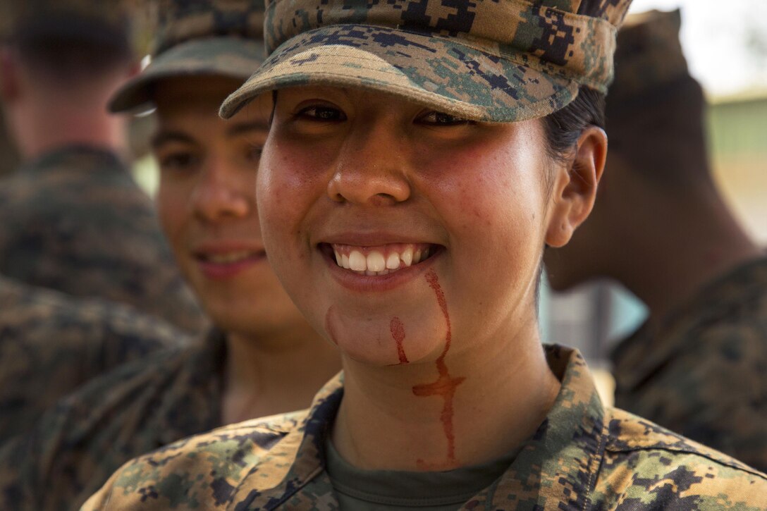 Marine Corps Lance Cpl. Jasmine Solano smiles after drinking cobra blood during Cobra Gold 17 at Camp Ban Chan Krem, Thailand, Feb. 17, 2017. Solano is assigned to Battalion Landing Team, 2nd Battalion, 5th Marine Regiment, 31st Marine Expeditionary Unit, 3rd Marine Expeditionary Force. Marine Corps photo by Cpl. Steven Tran