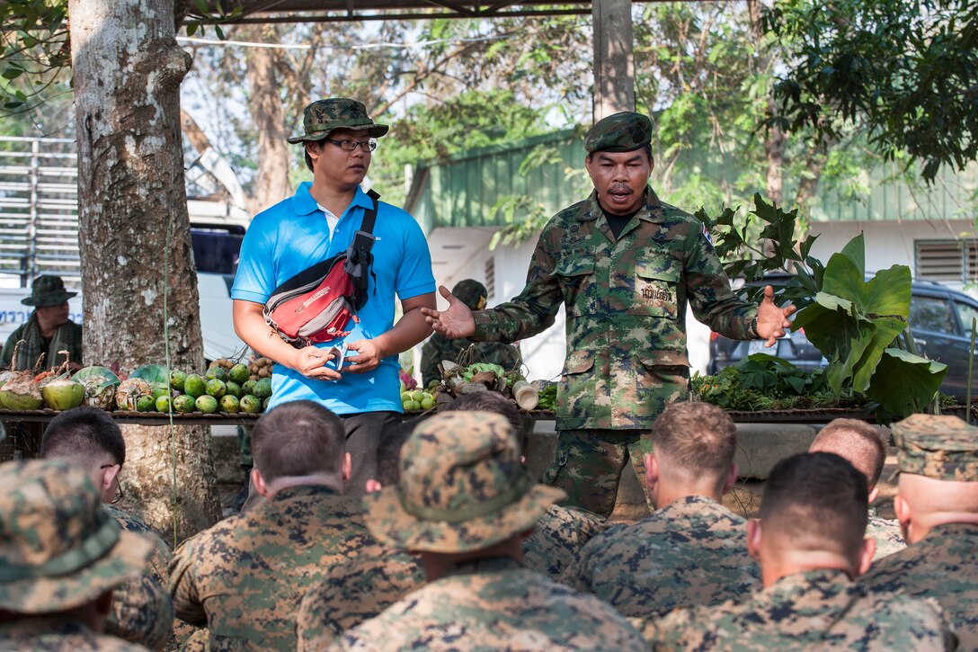 Thai Sgt. Chaiwat Lodsin, right, explains different kinds of jungle vegetation and herbs during jungle survival training as part of Cobra Gold 17 at Camp Ban Chan Krem, Thailand, Feb. 17, 2017. Lodsin is a jungle survival training instructor assigned to the Thai Reconnaissance Battalion. Navy photo by Petty Officer 2nd Class Markus Castaneda
