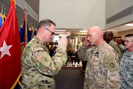 Brig. Gen. Frederick R. Maiocco, Jr., left, Commanding General, 85th Support Command, returns a salute to Chief Warrant Officer 5 Eric Nordby, Command Chief Warrant Officer, 85th Support Command, during a promotion ceremony at the command's battle assembly weekend, Feb. 11, 2017.
(Photo by Sgt. Aaron Berogan)