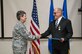 Gen. Ellen Pawlikowski congratulates Greg Gangnuss after presenting him with the Air Force Civilian Award for Valor during a Feb. 22 commander’s call at Joint Base San Antonio, Texas. Gangnuss served as a senior environmental advisor for the Ministry of Defense Advisor Program during his deployment. Pawlikowski is the commander of Air Force Materiel Command. 
(Courtesy photo)
