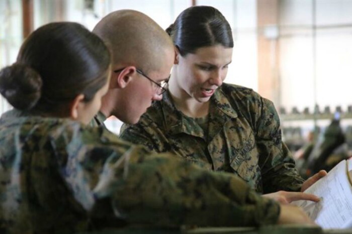 1st Lt. Morgan White, right, instructs her Marines during a squadron-wide gear inspection aboard Marine Corps Air Station Cherry Point, N.C., Feb. 6, 2017. Photo by Cpl. Mackenzie Gibson