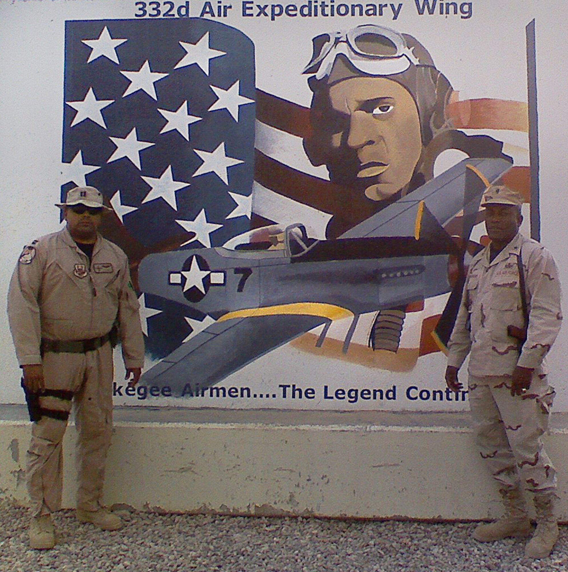 Then Capt. Ronnie, now Lt. Col., with the 432nd Wing/432nd Air Expeditionary Wing, left, and his father, then Brig. Gen. Ronnie, now retired Lt. Gen., right, stand in front of the 332nd Air Expeditionary Wing Tuskegee Airmen mural September 2007, at Joint Base Balad, Iraq. (Courtesy photo)