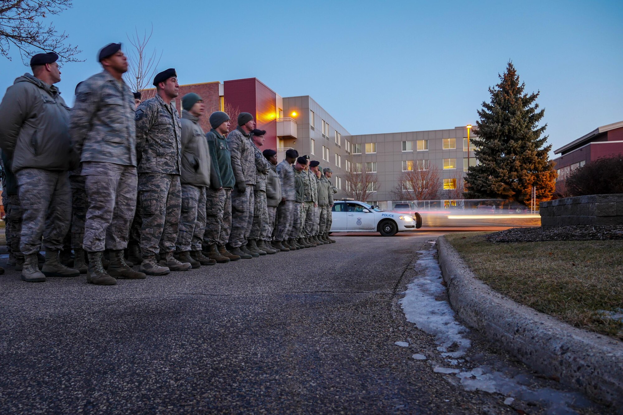 Defenders of the 934th Security Forces Squadron honor Old Glory during Reveille on Feb 12, 2017 signaling the official start of the duty day. (U.S. Air Force photo by Staff Sgt. Corban Lundborg) 
