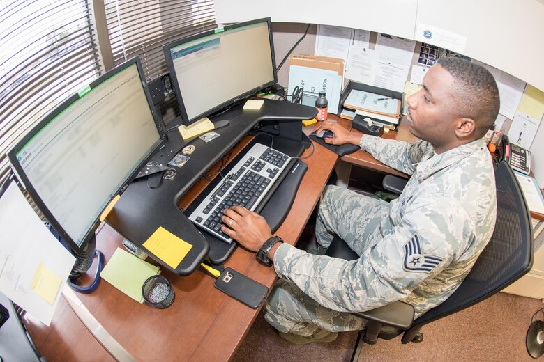 Staff Sgt. Bruce Daniels, a 43d Comptroller Flight financial analyst, certifies a purchase request while working in the Defense Enterprise Accounting Management System in the Pope Airman Support Center here Feb. 22. Daniels is part of a team which has gone all green on the Air Mobility Command Financial Management "stoplight chart" for four months running -- an accomplishment unmatched in the command. (U.S. Air Force photo/Marc Barnes)