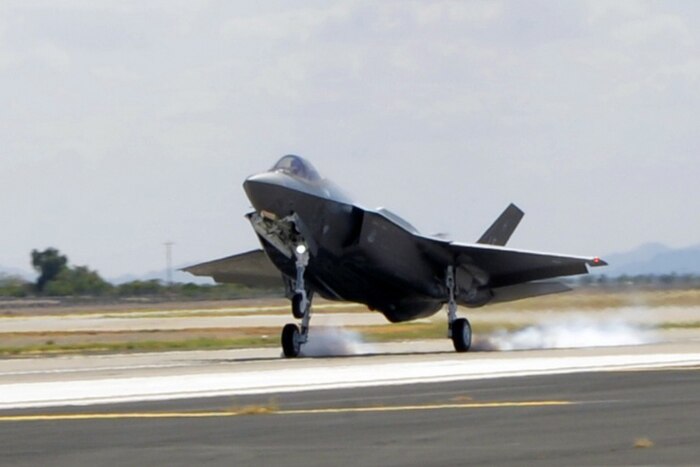 The Air Force’s 100th F-35 Lightning II lands at Luke Air Force Base, Ariz., Aug. 26, 2016. The aircraft, designated AF-100, marked a milestone for the F-35 program. Air Force photo by Staff Sgt. Marcy Copeland
