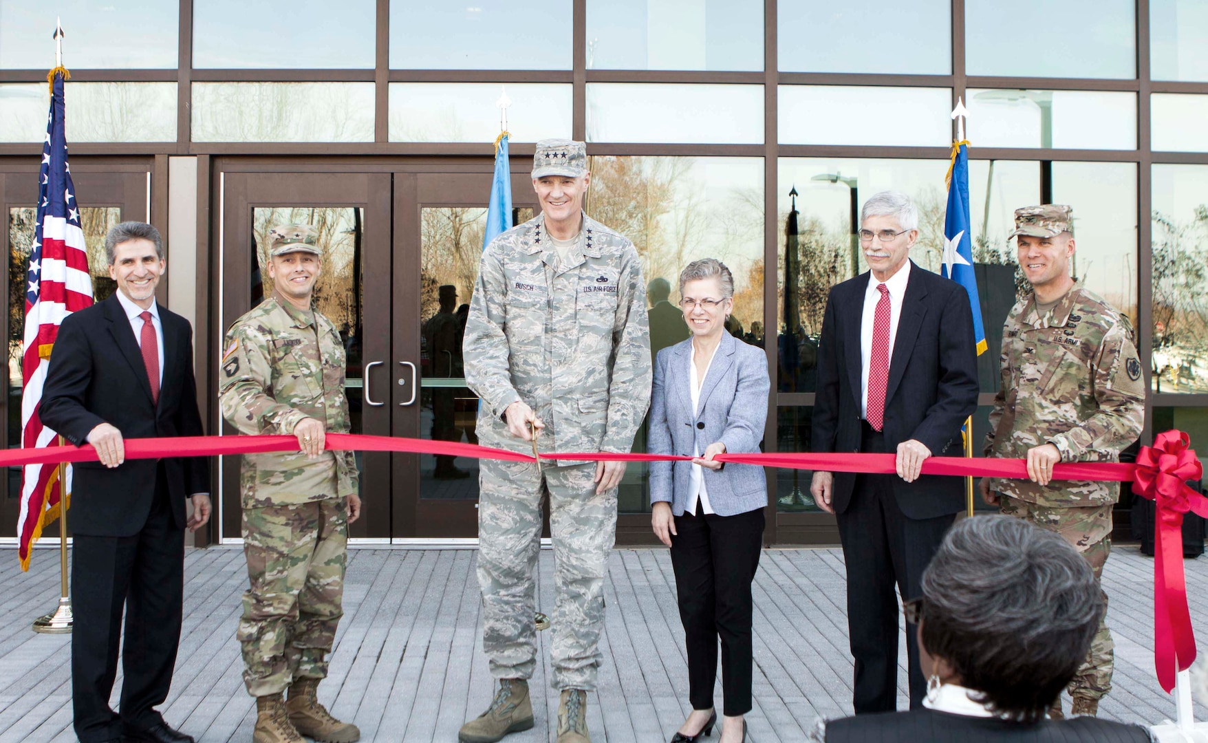 From left, Robert Montefour, site director, DLA Installation Support at Susquehanna; Army Brig. Gen. John S. Laskodi, DLA Distribution commanding general; Air Force Lt. Gen. Andy Busch, DLA director; Twila Gonzales, DLA Distribution deputy commander; Denis du Breuil, deputy chief of Construction-North, U.S. Army Corps of Engineers, Baltimore District; and Army Col. Brad Eungard, installation commander, cut the ribbon on DLA Distribution’s new headquarters building.