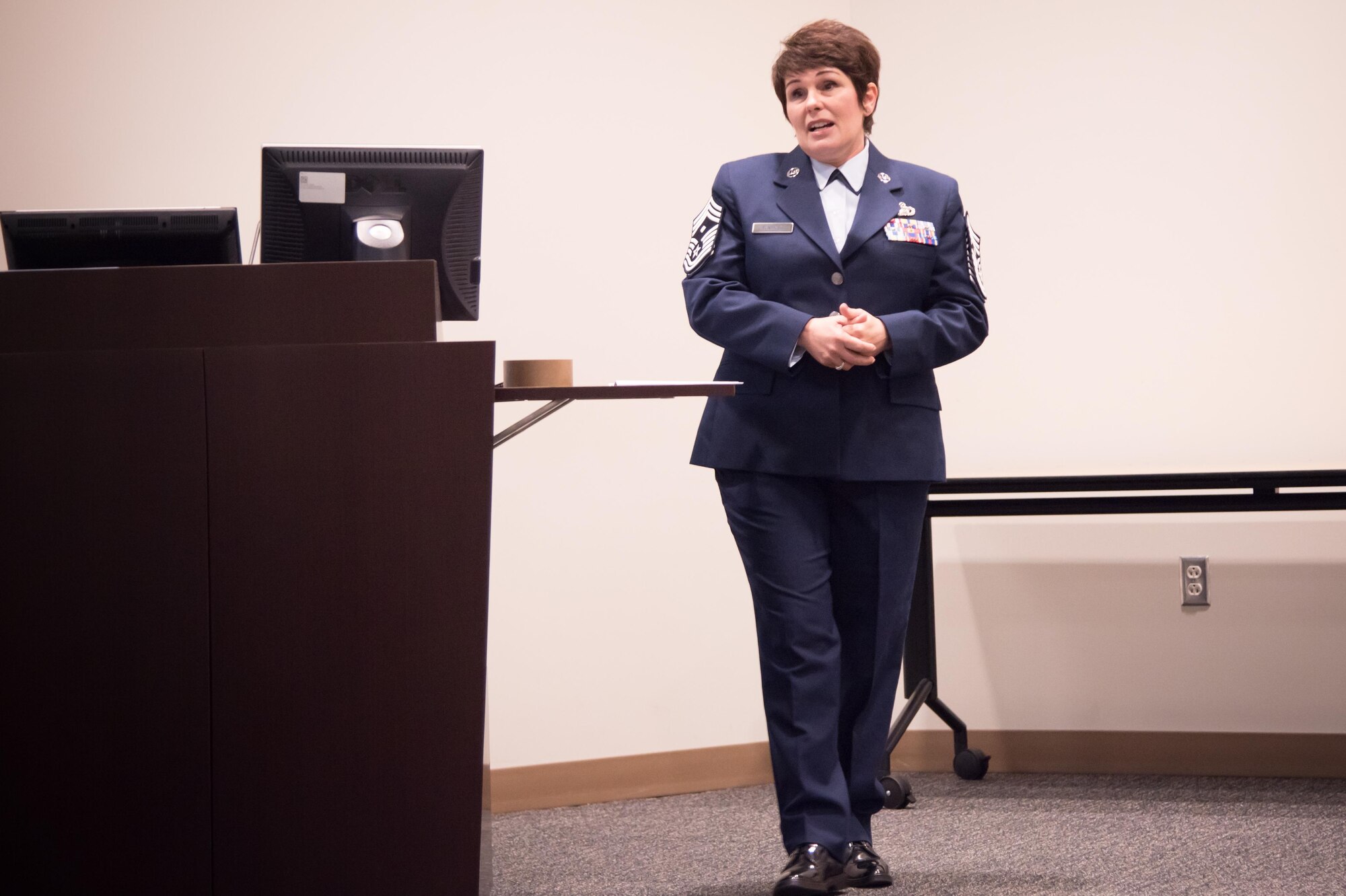 Chief Master Sgt. Michelle Santiago, 403rd Maintenance Squadron first sergeant, speaks at her promotion ceremony Feb. 11 at Keesler Air Force Base, Mississippi. (U.S. Air Force photo/Staff Sgt. Heather Heiney)