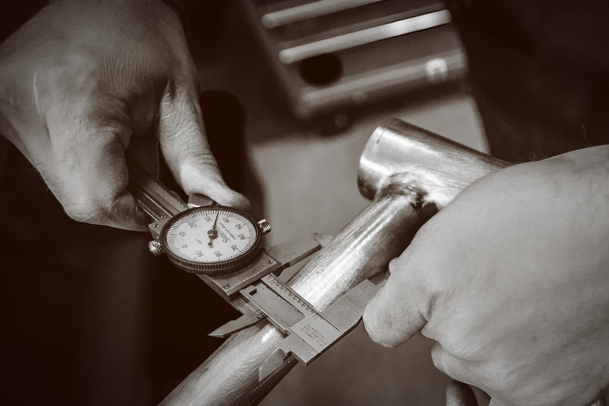 Air Force 1st Lt. Ken Cerreta uses Vernier calipers to measure the top tube on a bicycle frame he’s building for a customer. Each steel frame Cerreta builds is fitted to exact customer specifications. (Paul Holcomb/U.S. Air Force)