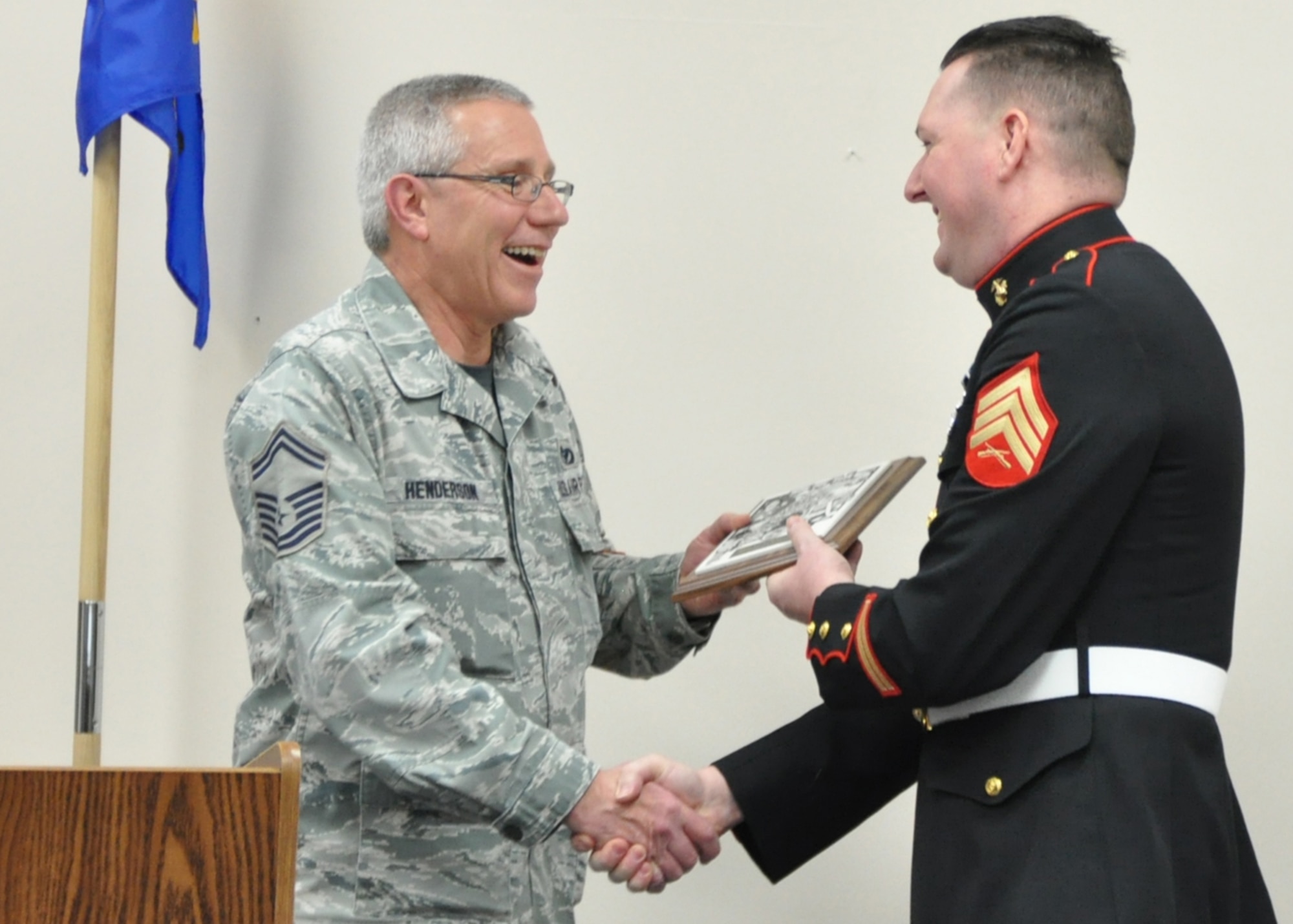 Master Sgt. Gary Henderson, 910th Airlift Wing Toys for Tots committee chairperson and 910th Civil Engineer Squadron (CES) operations manager, receives a plaque from Marine Corps Sgt. William Clark, YARS Marine Corps Reserve Toys for Tots Program Manager and a Small Arms Repairer assigned to Detachment 3, Maintenance Company, at a ceremony at the 910th CES building here, Feb. 5, 2017. The ceremony recognized the efforts of 910th Airlift Wing Airmen who gave more than 1500 hours of service assisting with the total collection of 10,415 toys, 1,477 books, 9,422 stocking stuffers and $38,055.81 of local monetary donations. The Airmen’s efforts also assisted in the distribution of 18,764 toys, 2,724 books and 13,875 stocking stuffers as Christmas gifts for more than 5500 children. For more information about U. S. Marine Corps Reserve Toys for Tots Program, please visit their website at www.toysfortots.org. (U.S. Air Force photo/Senior Airman Joshua Kincaid)        