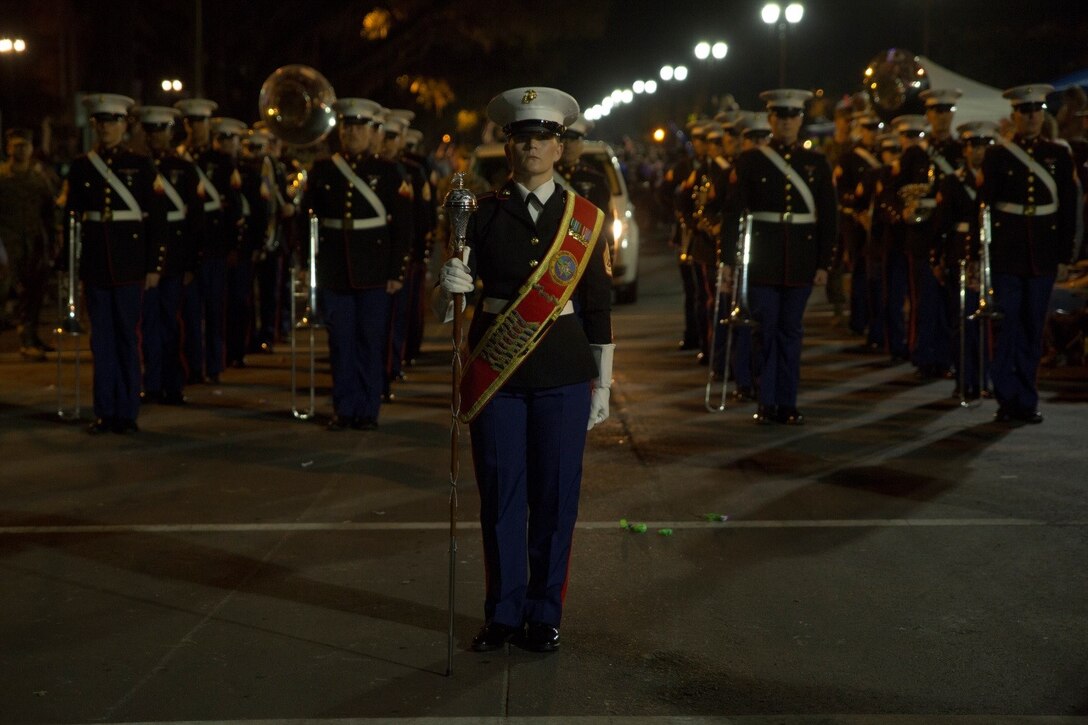 Gunnery Sgt. Stacie D. Crowther, drum major for Marine Corps Band New Orleans, Marine Forces Reserve leads the band as they perform in the Krewe of Druids parade during Mardi Gras in New Orleans, Feb. 22, 2017. The band participated in numerous parades to promote the Marine Corps and support the New Orleans community. (U.S. Marine Corps photo by Cpl. Melissa Martens/ Released)   