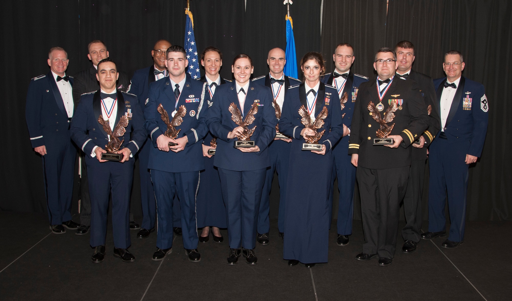The outstanding Airmen of the 71st Flying Training Wing were recognized during the 2016 Annual Awards banquet Feb. 17 at the Vance Collocated Club. Front row from left: Capt. Carlos M. Moralejo Jr., Senior Airman Chase Kelly, Senior Airman Danica G. Golightly, 1st Lt. Mia E. Gwirtsman and Navy Lt. Austin M. Nasca. Back row from left: Col. Darrell Judy, 71st FTW commander, David M. Harris, Master Sgt. Richard A. Parks, Maj. Megan S. Brandt, Capt. Richard M. Kirwan Jr., Capt. Jeffrey M. Kelley, Navy Lt. Michael B. Gawne and Chief Master Sgt. Jeffrey Wilson, 71st FTW command chief. (U.S. Air Force photo/ Tech. Sgt. James Bolinger)