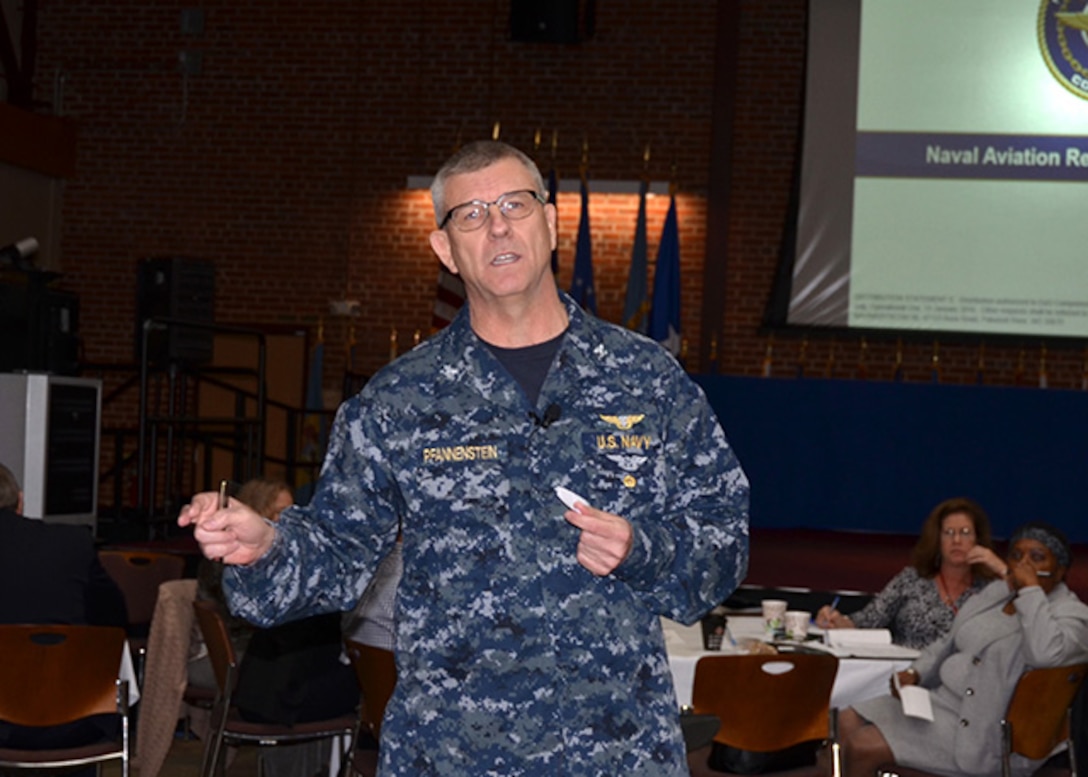 Navy Capt. Timothy Pfannenstein, Logistics and Industrial Operations executive director, Naval Air Systems Command in Patuxent River, Maryland, presents the Navy and Marine Corps readiness challenges during the annual Senior Leadership Conference Feb. 7-9, 2017 on Defense Supply Center Richmond, Virginia. Defense Logistics Agency Aviation leadership and strategic partners came together to discuss ways to improve logistics performance.