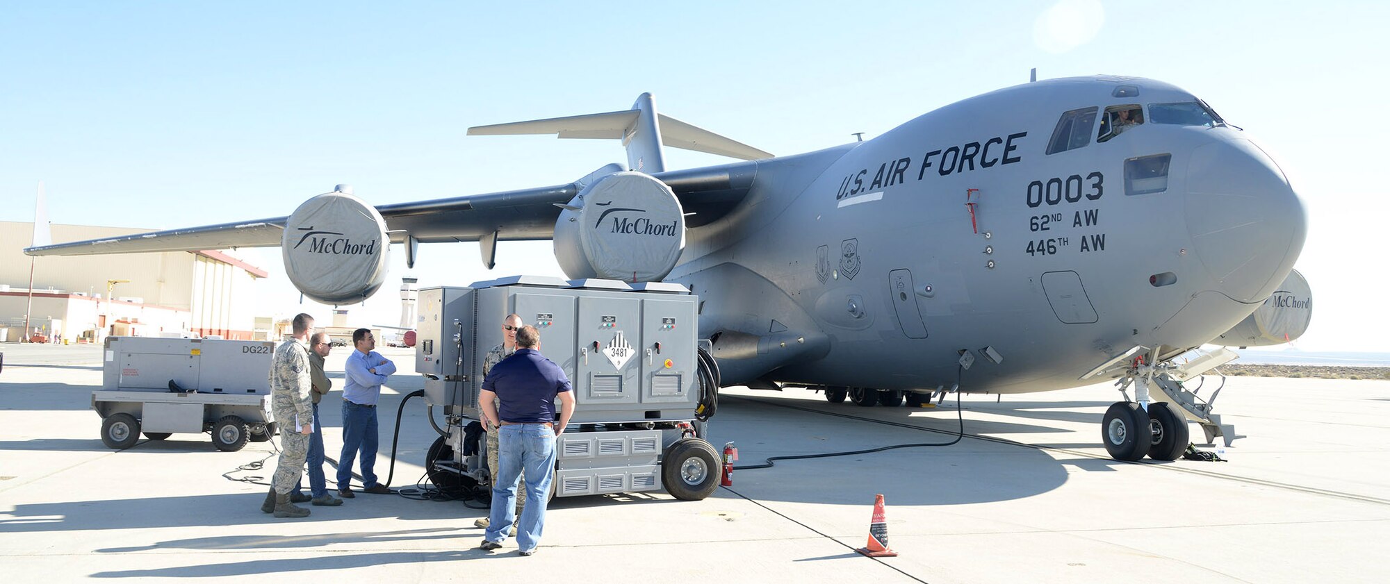 The test team monitors the HEF during the C-17 portion of the Hybrid Electric Flightline Cart Technology Pathfinder tests. The HEF was a concept demonstrator built to explore an all-electric or hybrid electrical power supply for use by flightline maintainers. Some possible advantages are lower noise, less emissions and less maintenance than the diesel generators currently in use. (U.S. Air Force photo by Christopher Ball)
