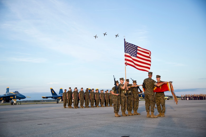 U.S. Marines assigned to Marine Tactical Electronic Warfare Training Squadron 1 attendees stand in formation during a deactivation ceremony at Marine Corps Air Station Cherry Point, N.C., April 29, 2016. VMAQT-1 is the first of four Prowler squadrons to be deactivated after more than 60 years of service. Marine Air-Ground Task Force - Electronic Warfare is what the Marine Corps will transition to as the Prowler is replaced. (U.S. Marine Corps photo by Cpl. Jodson B. Graves/Released)