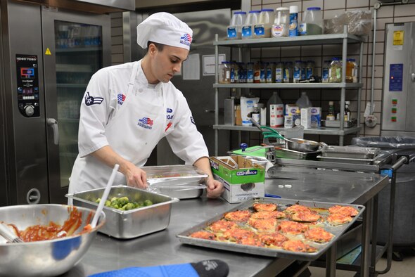 U.S. Air Force Airman 1st Class Tyler Morgan, a 354th Force Support Squadron food service journeyman, wraps vegetables for lunch Feb. 22, 2017, at Eielson Air Force Base, Alaska. The Two Seasons Dining Facility was the Pacific Air Forces nomination to compete for the Air Force Hennessy Award. (U.S. Air Force photo by Airman 1st Class Cassandra Whitman)