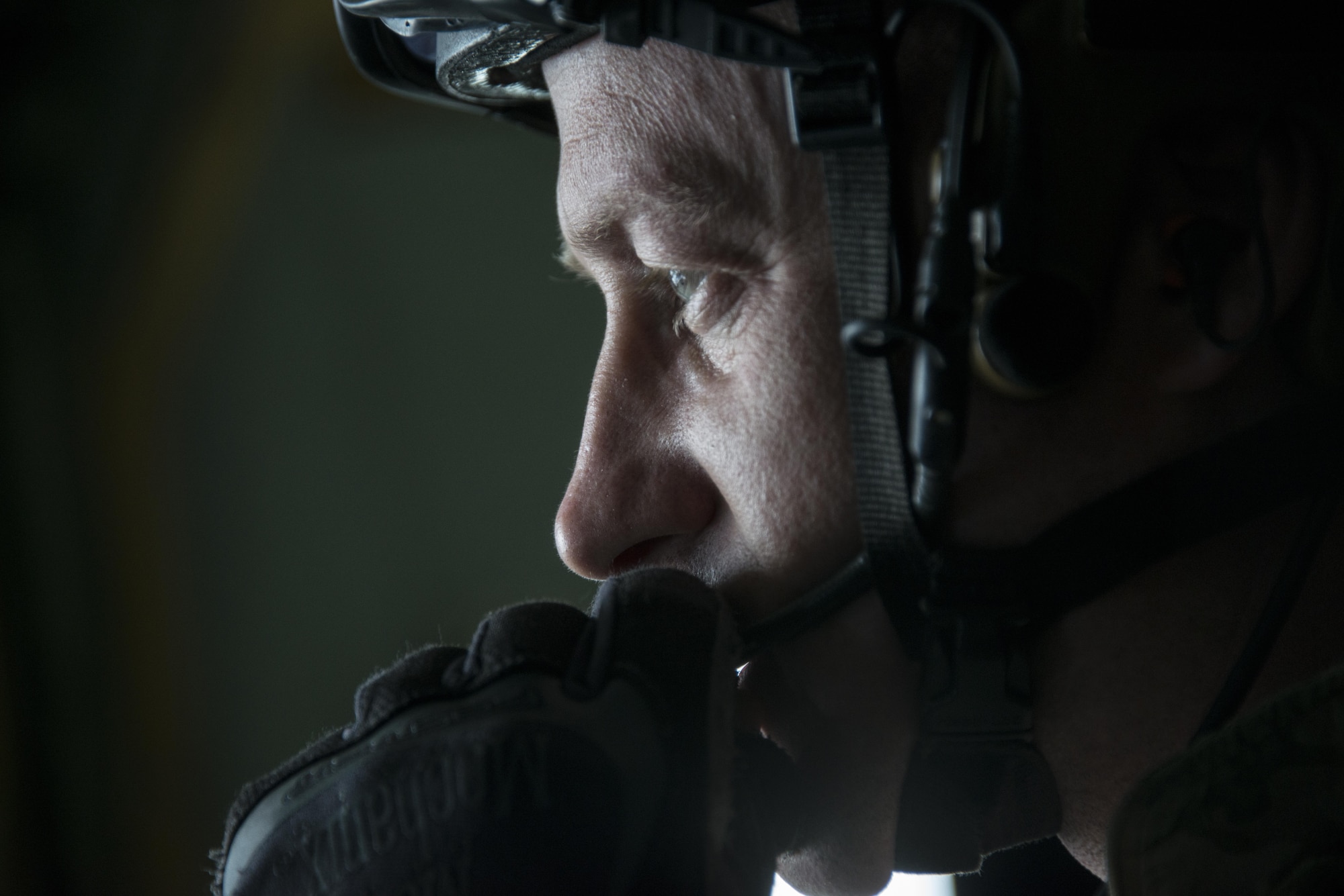 A U.S. Air Force jump master assigned to the 320th Special Tactics Squadron identifies the water drop zone prior to bilateral jump operations from a U.S. Air Force MC-130J Commando II assigned to 17th Special Operations Squadron, Feb. 17, 2017 at Korat Air Base, Thailand. Pararescuemen from the 320th STS and Royal Thai Air Force Special Operations Regiment exercised water recovery operations as a part of Cobra Gold 2017. (U.S. Air Force photo by Capt. Jessica Tait)