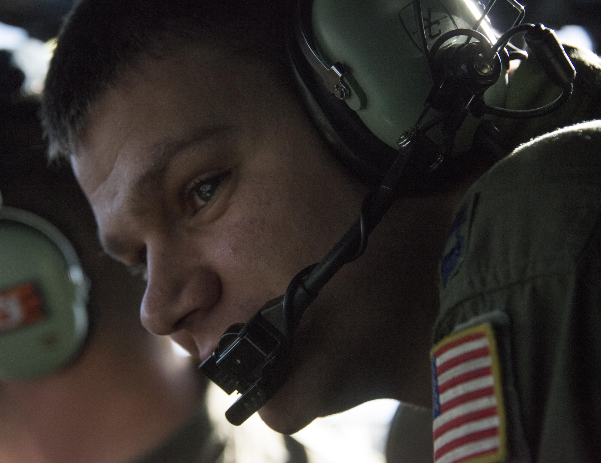 U.S. Air Force Capt. Peter Cahilly, 17th Special Operations Squadron combat systems operator, looks out the window of a U.S. Air Force MC-130J Commando II during low-level operations, Feb. 17, 2017 at Korat Air Base, Thailand. Throughout Cobra Gold 2017, the 17th SOS provided specialized aviation to members of the 320th Special Tactics Squadron and Royal Thai Air Force Special Operations Regiment. (U.S. Air Force photo by Capt. Jessica Tait)