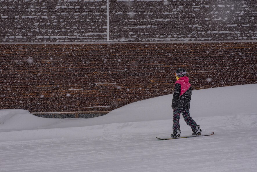 A snowboarder rides along a trail next to the lodge during a 374th Force Support Squadron Outdoor Recreation trip to Myoko-Suginohara ski resort Feb. 11, 2017, in the Niigata prefecture, Japan. Yokota’s Outdoor Recreation offers over 40 winter trips each year to various ski resorts throughout Japan. (U.S. Air Force Photos by Airman 1st Class Donald Hudson)