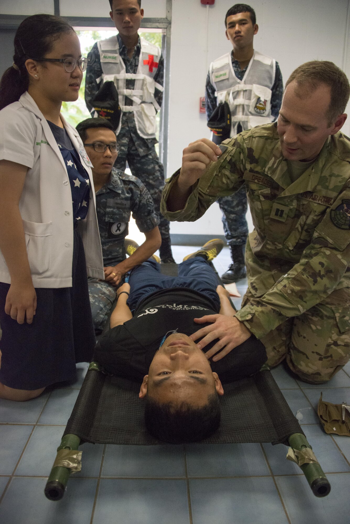 U.S. Air Force Capt. Zachary Dreaden, 353rd Special Operations Support Squadron flight surgeon, instructs the step-by-step technique to perform a surgical airway during a medical exchange with counterparts from the Royal Thai Air Force Wing 1 Hospital, Feb. 22, 2017 at Korat Air Base, Thailand. The medical activities conducted during Cobra Gold 2017 supported the needs and humanitarian interests of civilian populations across the region. (U.S. Air Force photo by Capt. Jessica Tait)