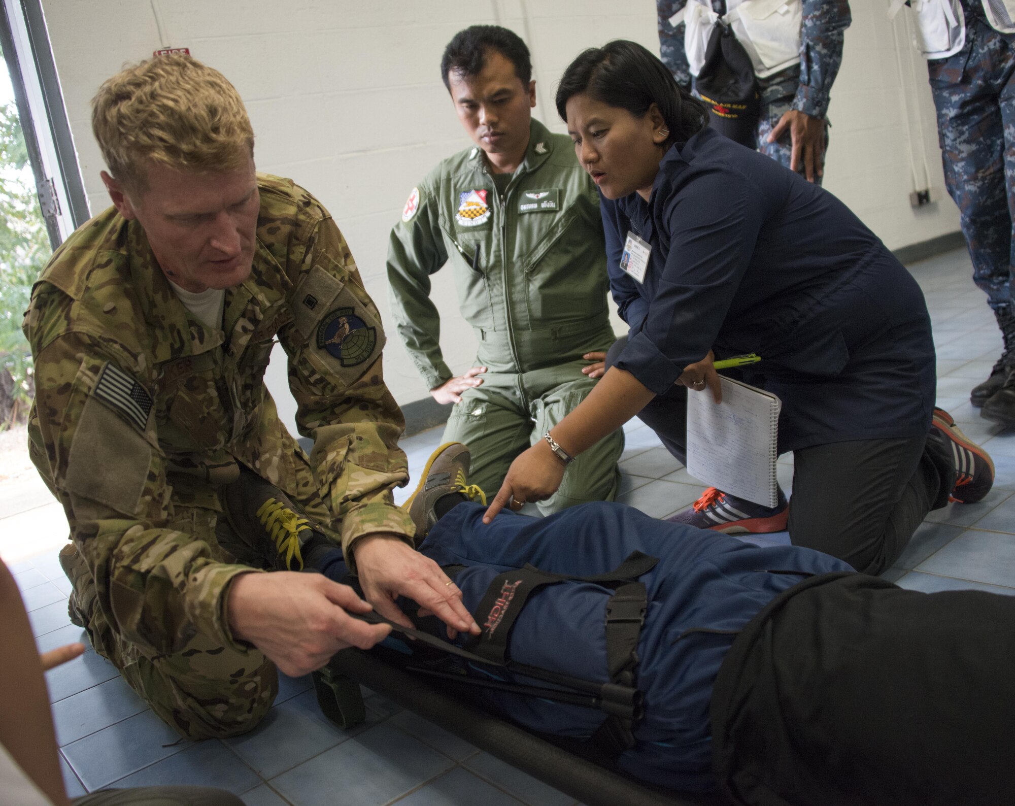 U.S. Air Force Lt. Col. Chris Walker, 353rd Special Operations Group group surgeon, demonstrates application of a traction splint during a medical exchange with counterparts from the Royal Thai Air Force Wing 1 Hospital, Feb. 22, 2017 at Korat Air Base, Thailand. Cobra Gold 2017 provided an opportunity for both the United States and partner nation to advance interoperability and partner capacity. (U.S. Air Force photo by Capt. Jessica Tait)