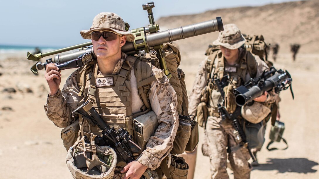 SENOOR BEACH, Oman (Feb. 15, 2017) U.S. Marine Cpl. Johnathan Riethmann, a mortarman with Company A, Battalion Landing Team 1st Bn., 4th Marines, 11th Marine Expeditionary Unit, walks to a staging area at Senoor Beach, Oman, in preparation for Exercise Sea Soldier, Feb. 15. Sea Soldier 2017 is an annual, bilateral exercise conducted with the Royal Army of Oman designed to demonstrate the cooperative skill and will of U.S. and partner nations to work together in maintaining regional stability and security. USS Somerset, with the embarked 11th Marine Expeditionary Unit, is deployed in the U.S. 5th Fleet area of operations in support of maritime security operations designed to reassure allies and partners, preserve the freedom of navigation and the free flow of commerce and enhance regional stability. (U.S. Marine Corps photo by Gunnery Sgt. Robert B. Brown Jr.)