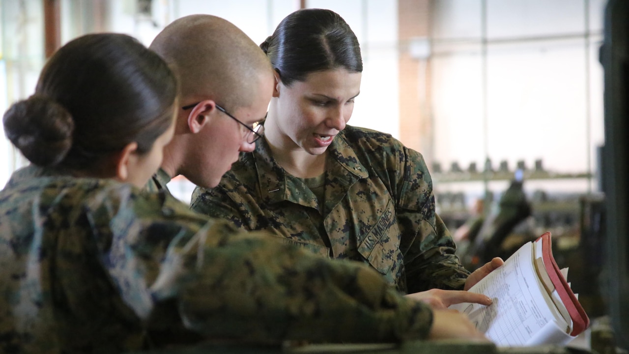 1st Lt. Morgan White, right, instructs her Marines during a squadron-wide gear inspection aboard Marine Corps Air Station Cherry Point, N.C., Feb. 6, 2017. White states that the training she has received in the Marine Corps helped develop her leadership and decision-making skills. “The Marine Corps teaches you to make hard decisions,” said White. “When life throws us questions that we don’t know the answer to, we’ve learned to quickly think on our feet.” White is the communications officer for Marine Wing Support Squadron 274, Marine Aircraft Group 14, 2nd Marine Aircraft Wing. 
