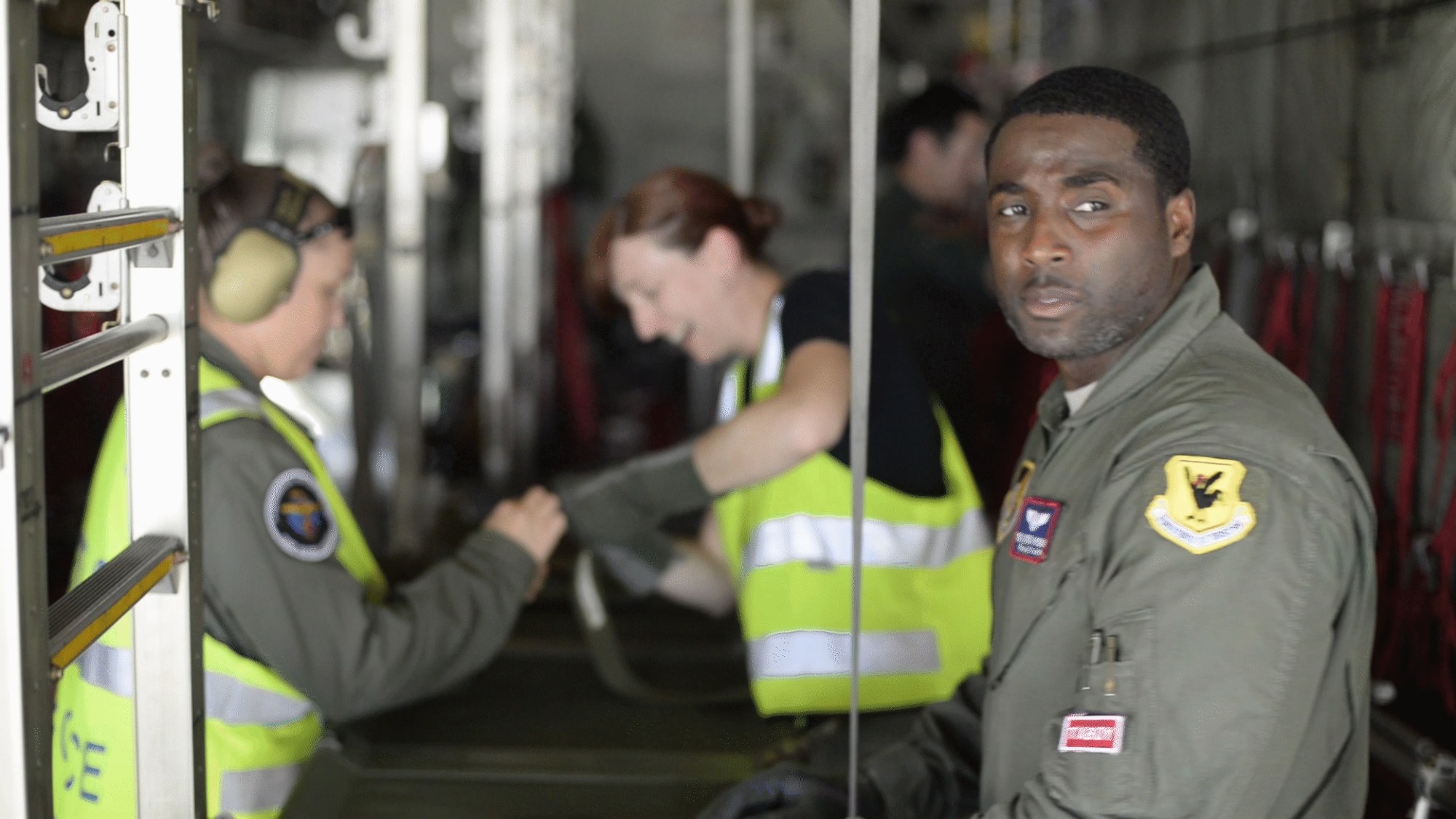 U.S. Air Force Tech. Sgt. Detrick Hysaw, 18th Aeromedical Evacuation Squadron AE technician, configures a Japan Air Self-Defense Force C-130 Hercules with Royal Australian Air Force Airmen for patient transport Feb. 21, 2017, at Andersen Air Force Base, Guam. Aeromedical evacuation Airmen from Kadena Air Base, Japan, completed medical training with Australian and Japanese airmen during annual exercise Cope North. The 18th AES maintains a forward presence and supports medical contingencies in the Pacific, reaching from the Horn of Africa to Alaska. (Courtesy photo)