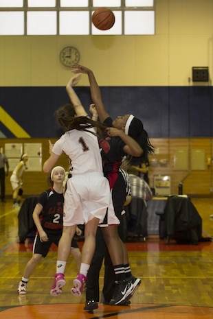 Lebet Erhart, left, a guard with Matthew C. Perry High School’s Lady Samurai basketball team, jumps for the ball to start a game against E.J. King High School during the 2017 Division 2 Girls’ Basketball Tournament at the IronWorks Gym on Marine Corps Air Station Iwakuni, Japan, Feb. 22, 2017. M.C. Perry High School hosted 11 teams from the Far East Division for the tournament. The teams endured two days of physically demanding competition for the opportunity at a championship game in a double-elimination style tournament. (U.S. Marine Corps photo by Lance Cpl. Joseph Abrego)