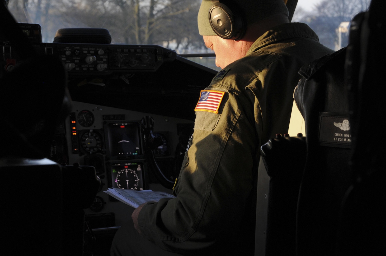 Lt. Col. Charles Taylor, a pilot assigned to the 185th Air Refueling Wing, examines preflight checklists on a KC-135 aircraft at Geilenkirchen NATO Air Base on Feb. 14 2017. Approximately 40 members of the 185th are working at the air base supporting NATO training operations. 