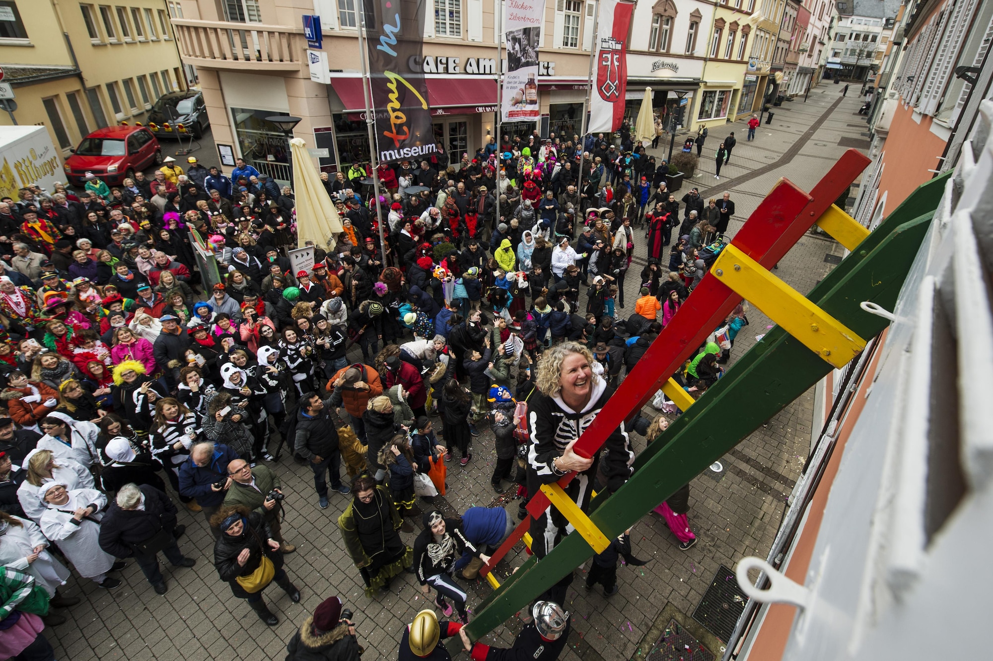 Heather Horton, spouse of the 52nd Fighter Wing vice commander, climbs the ladder up to city hall during a Fasching celebration in Wittlich, Germany, Feb. 23, 2017. Once the ladies have “taken over” the city hall, the celebrations begin with dancing and parading throughout the city. The traditional Fasching celebrations begin the Thursday prior to Lent at the 11th minute past the 11th hour, continue until Ash Wednesday and allow people to indulge before the Lent season. (U.S. Air Force photo by Staff Sgt. Jonathan Snyder)