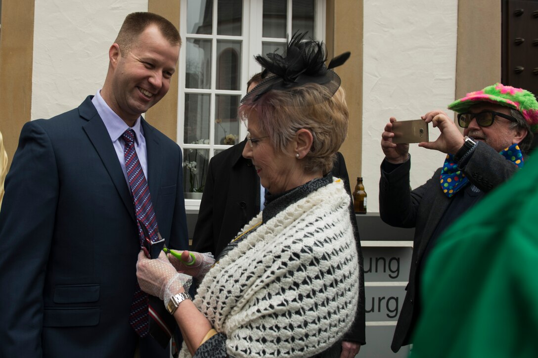 Chief Master Sgt. Edwin Ludwigsen, 52nd Fighter Wing command chief, gets his tie cut off during the 2017 Storming of the Rathaus Fasching event in Bitburg, Germany, Feb. 23, 2017. A woman cutting off a man’s tie is a longtime tradition observed during Fasching. (U.S. Air Force photo by Senior Airman Dawn M. Weber)