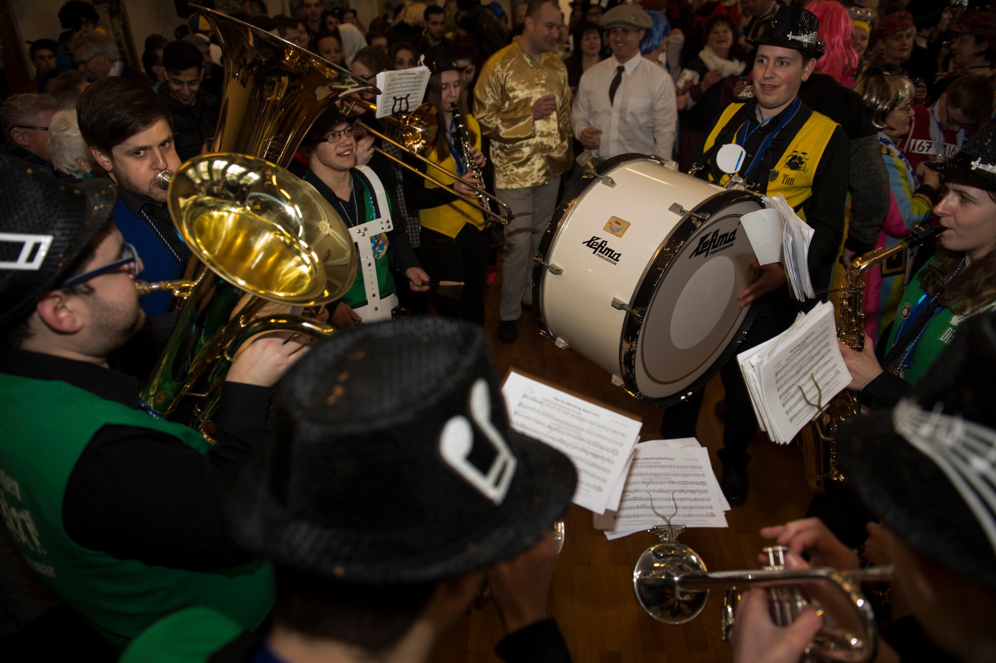 Musicians play music while revelers lock arms and dance to music as part of a Fasching celebration at the city hall in Bitburg, Germany, Feb. 22, 2017. Fasching is a yearly celebration put on by the Germans to commemorate the start of the spring season. (U.S. Air Force photo by Senior Airman Dawn M. Weber)