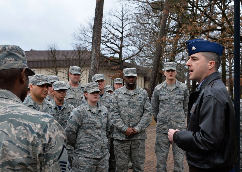 Lt. Col. Richard D. Engelman, 786th Civil Engineer Squadron commander, briefs his Airmen about the history of the River Rats Memorial monument on Ramstein Air Base, German, Feb. 17, 2017. The monument was established by Red River Rats Fighter Pilots Association Ramstein in 1976 to commemorate those who lost their lives in the Vietnam War. (U.S. Air Force photo by Airman 1st Class Joshua Magbanua)