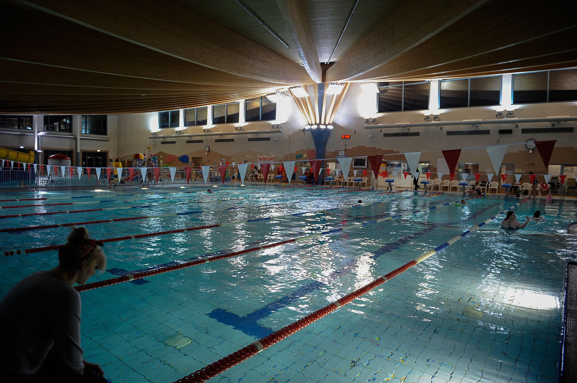 Participants enter the pool for a swim class at the Aquatic Center on Ramstein Air Base, Germany, Feb. 14, 2017. Each week, Christina and Samantha Moore, take aquatic classes, yoga, and shoot for more than 120 minutes of exercise as part of the seventh annual Kaiserslautern Military Community’s ‘Biggest Loser’ challenge. (U.S. Air Force photo by Airman 1st Class Savannah L. Waters)