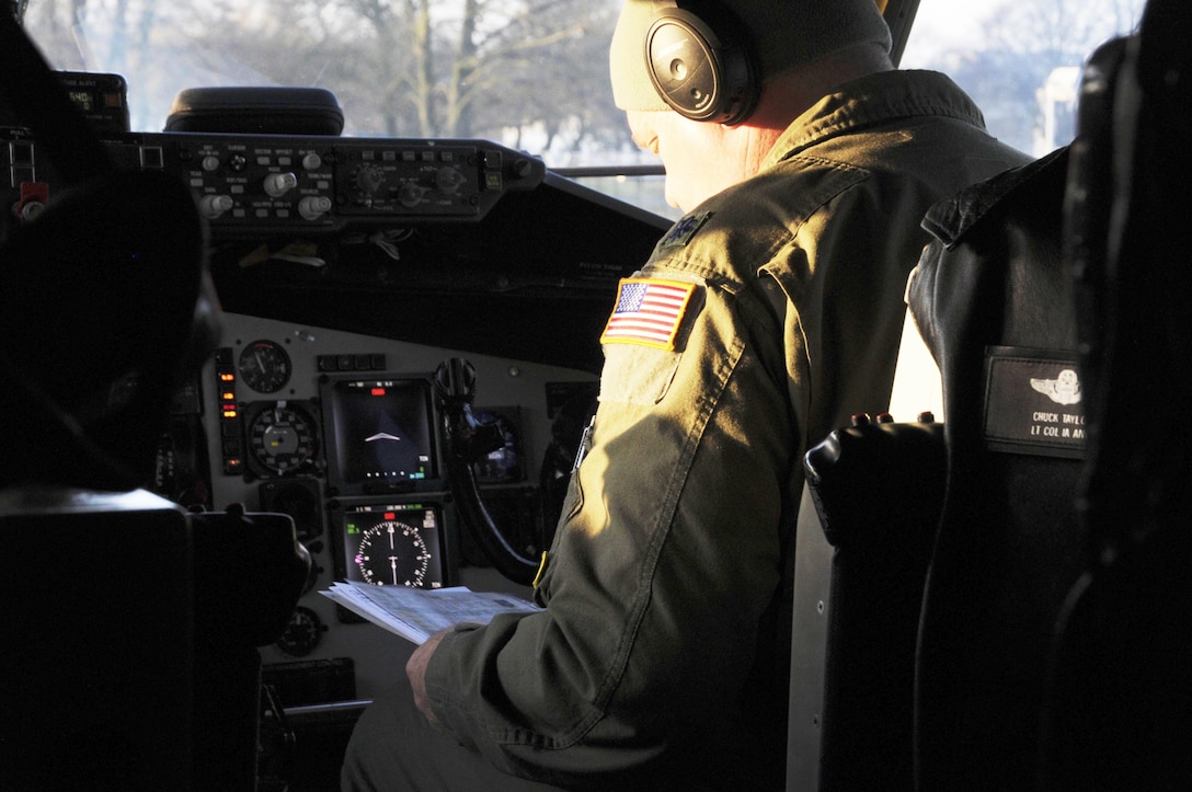 Lt. Col. Charles Taylor examines preflight checklists on a KC-135 aircraft at Geilenkirchen NATO Air Base, Feb. 14, 2017. Taylor is a pilot assigned to the 185th Air Refueling Wing which is working at the air base supporting NATO training operations. Air National Guard Photo by Staff Sgt. Ter Haar