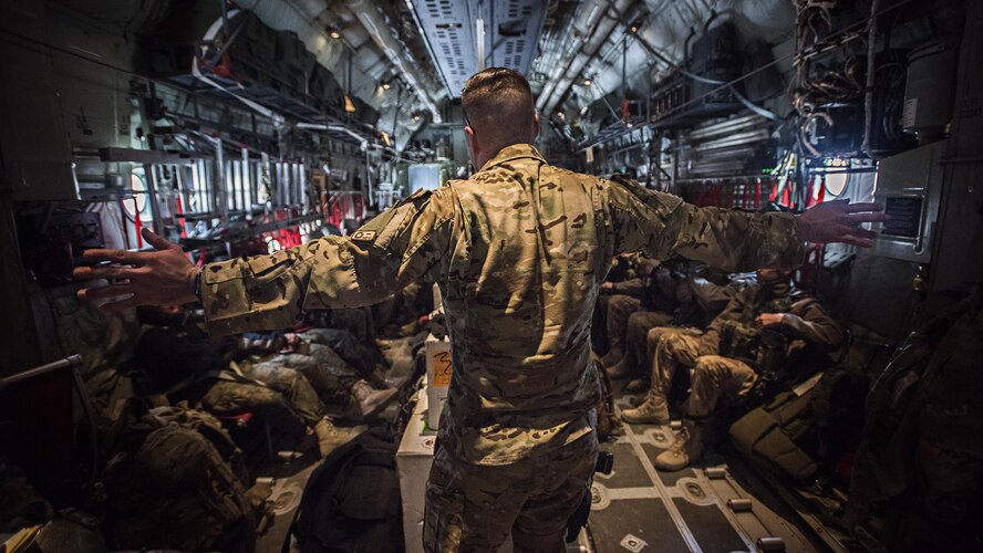 Staff Sgt. Chase Seynaeve, a 774th Expeditionary Airlift Squadron loadmaster, gives a flight safety briefing to passengers on a C-130J Super Hercules leaving from Bagram Airfield, Afghanistan, Feb. 17, 2017. The 774th EAS provides tactical airlift, including aeromedical evacuation, cargo and personnel airlift and airdrop, and any intra-theater transportation needed to support a successful train, advise, assist mission in Afghanistan. (U.S. Air Force photo/Staff Sgt. Katherine Spessa)