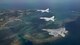 An Air Force F-15 Eagle and Navy F/A-18 Super Hornets fly in formation after a training sortie Feb. 16, 2017, over the Pacific Ocean. The joint training bolstered communications and interoperability between the two services, which both serve to enhance peace and security throughout the Indo-Asia Pacific region. (U.S. Air Force photo/Staff Sgt. Peter Reft)